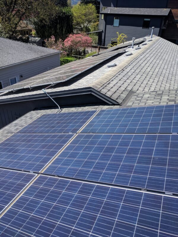 Image of solar panels on rooftops of main home and ADU - photo