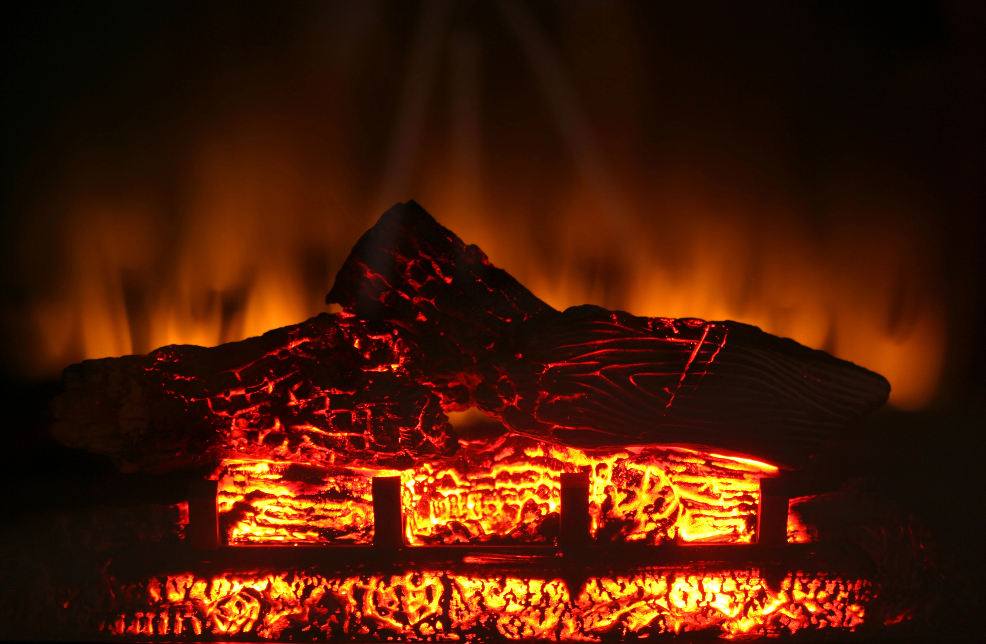 Mid-closeup of electric fireplace shows no-pollution "coals and flames" - photo