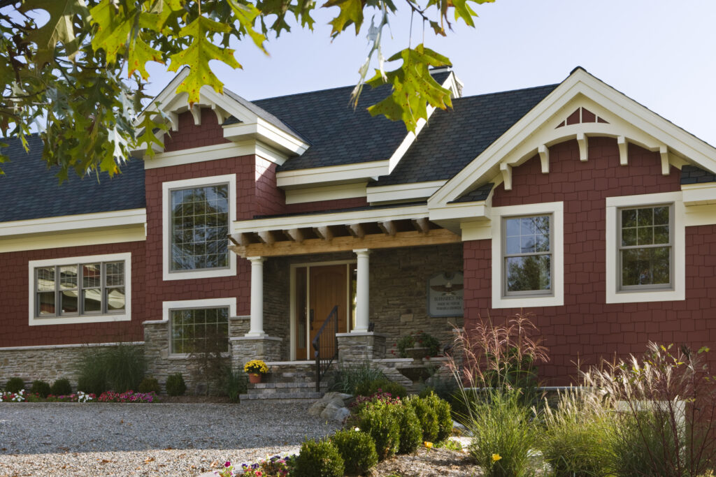 Exterior view of home with stone foundation and timber framing; SIP panel manufacturer Insulspan - photo