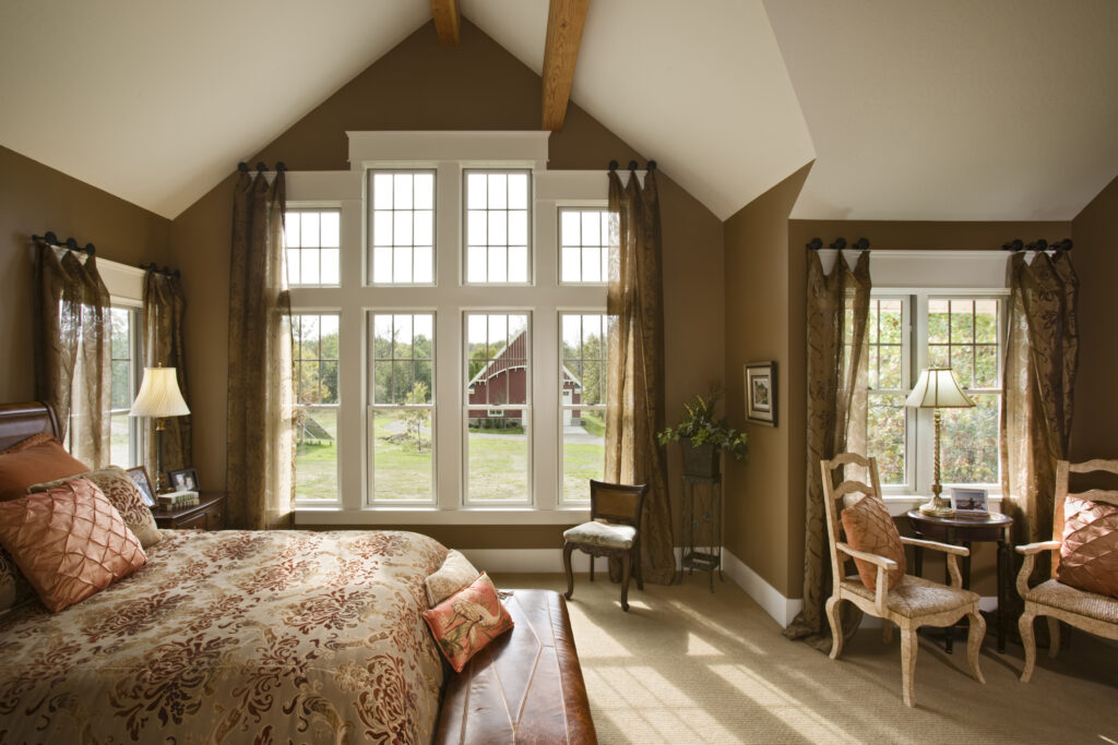 Interior view master bedroom looking out windows to barn, Burnside residence, Dexter, Michigan, Timber Framing; SIP panel manufacturer Insulspan - photo