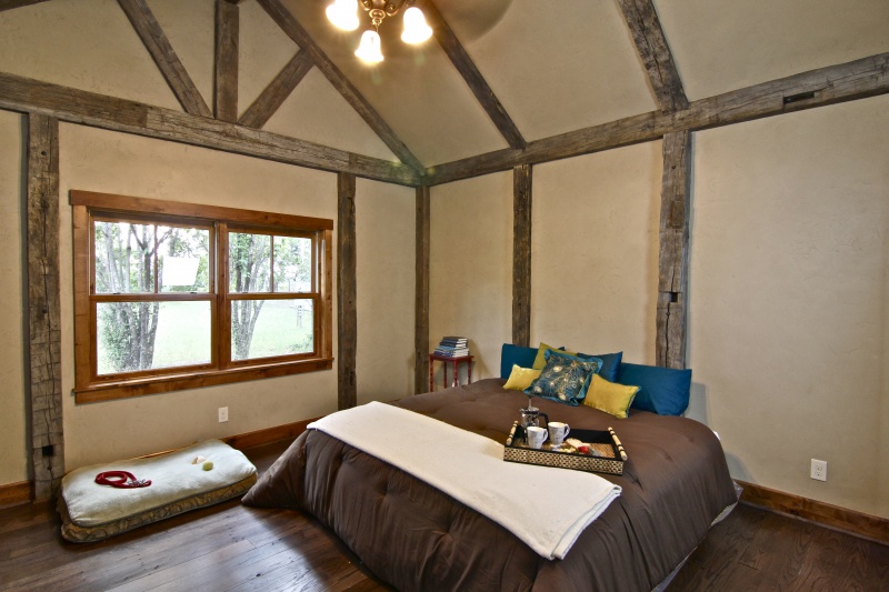 interior view of cozy,rustic bedroom in prefab SIP home; structural insulated panel manufacturer FischerSIPs - photo