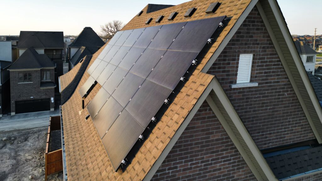 solar panels mounted on the roof of traditional-style net zero home - photo